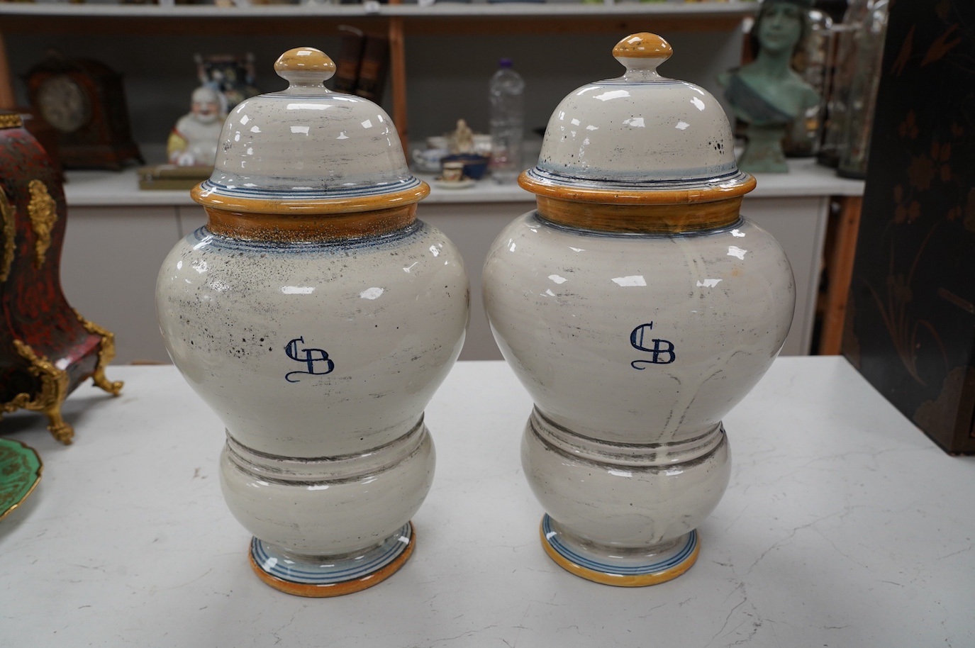 A pair of 17th century style maiolica drug jars and covers, 34cm. Condition - good